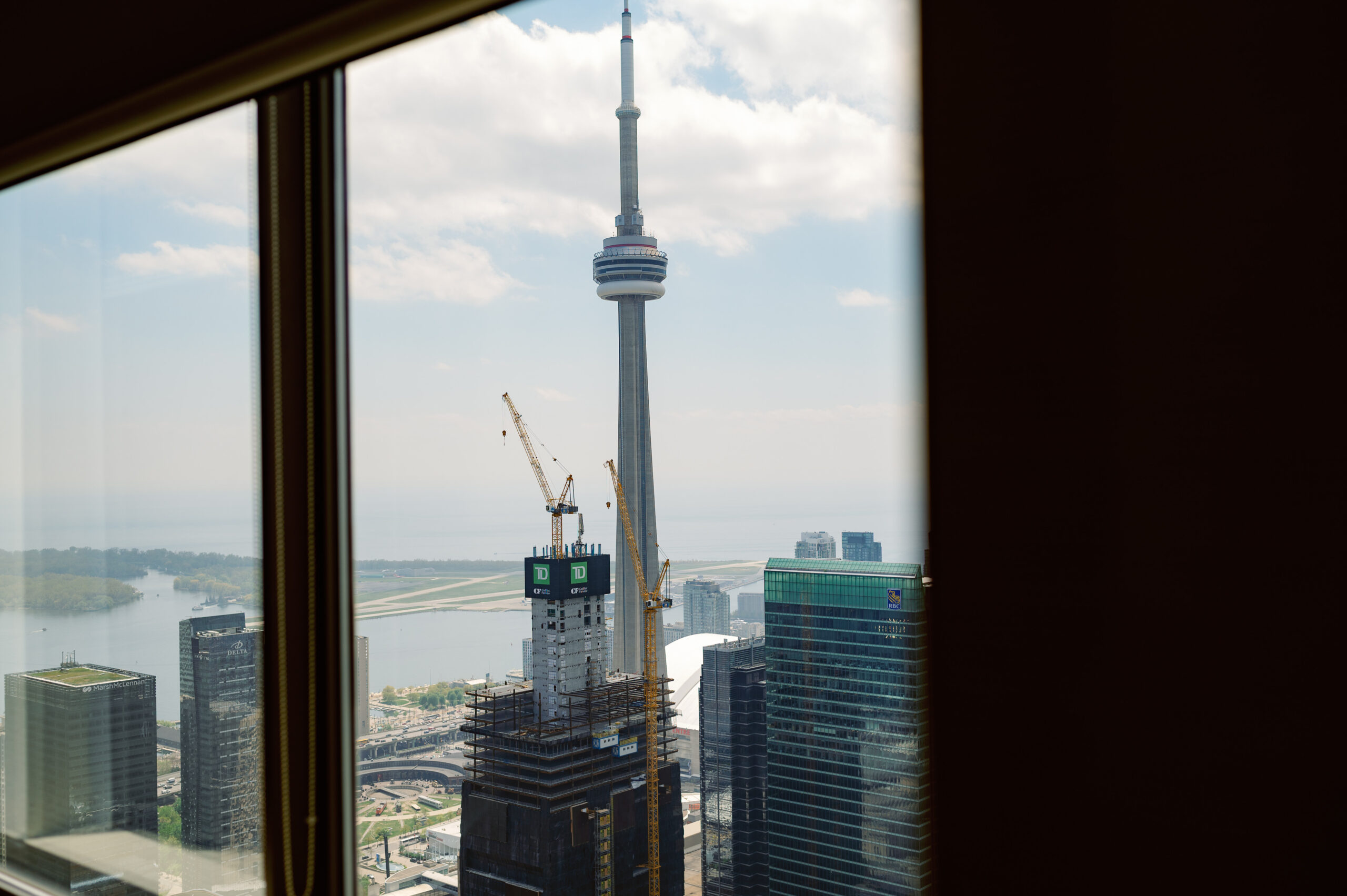 CN Tower view of Toronto through window